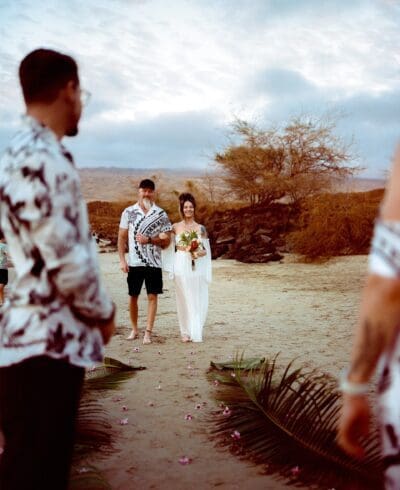 The Mathis wedding at Mau'umae Beach in Kona, Hawaii, captured by Sterling Batson, wedding photographer