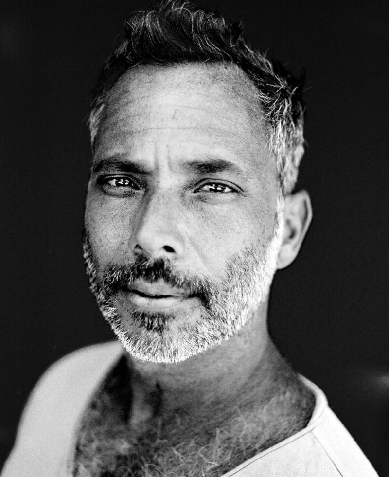 Black and white portrait of a gray-bearded man